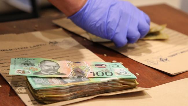 Police seized cash from homes in Gledswood Hills and Green Valley as part of the investigation. Picture: NSW Police