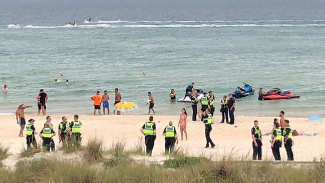 Police patrol Chelsea Beach on Thursday evening.