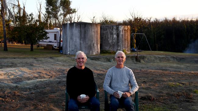 Twin brothers David (left) and Peter Abel from Mogo on the NSW south coast, lived in a caravan after their house was destroyed on December 29, 2019. Picture: Toby Zerna