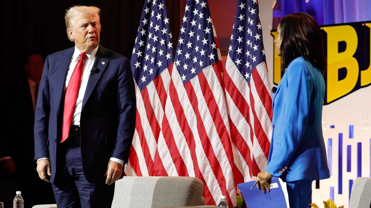 Mr Trump standing up to leave the event, earlier than scheduled, after being grilled by three black, female journalists. Pictured is ABC News’ Rachel Scott, who annoyed him the most. Picture: Kamil Krzaczynski/AFP