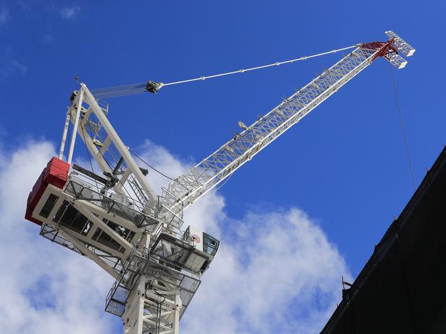 A crane reaching high at the Royal Hobart Hospital construction site.