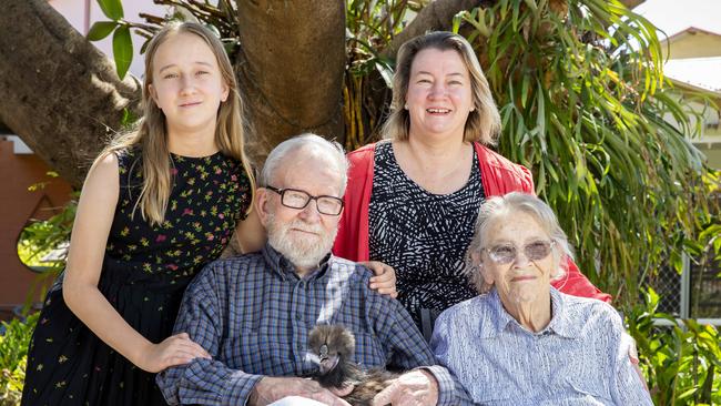 Roy Mason poses for a photograph with silky bantam with his family Saskia Rogers, Jill Rogers and Wilma Mason (AAP Image/Richard Walker)