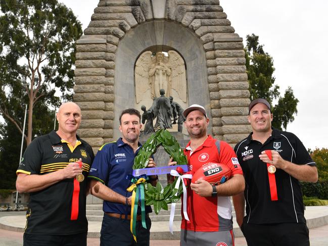 21/4/21. SANFL Anzac Round -  4 Coaches - Glenelg's Brett Hand, Eagles' Jade Sheedy, North Adelaide's Jacob Surjan and Port Adelaide's Matthew Lokan at the Adelaide National War Memorial.Picture: Keryn Stevens