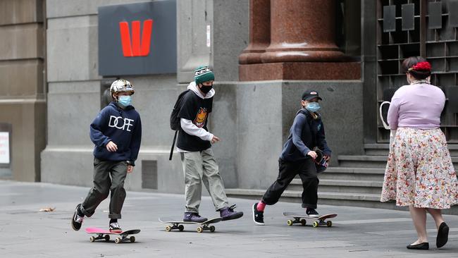 Skateboarders make the most of a quiet George St, Sydney, on Thursday. Picture: Tim Hunter.