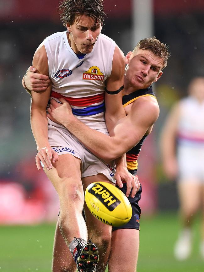 Rory Laird of the Crows tackles Bulldog Patrick Lipinski. Picture: Mark Brake/Getty Images