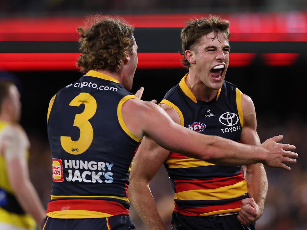 Billy Dowling (right) celebrates his first goal in the big time. (Photo by James Elsby/AFL Photos via Getty Images)