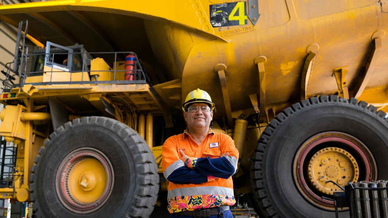 BHP Minerals Australia President Edgar Basto in front of a Komatsu haul truck at Goonyella Riverside Mine in Central Queensland