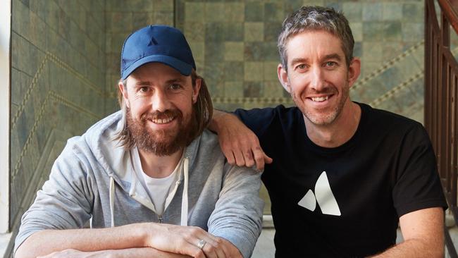 Mike Cannon-Brookes (baseball cap) and fellow founder of Atlassian, Scott Farquhar pictured together in their Sydney HQ