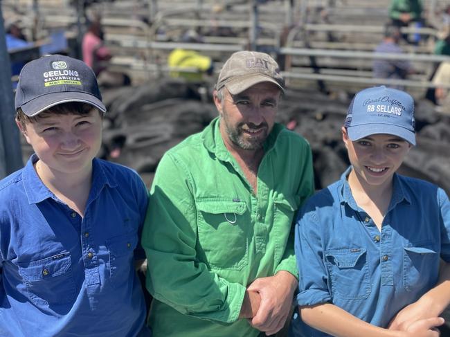 Dairy farmer Casey Taylor  sold 42 Angus-Friesian heifers to a top of $2190 for 21 heifers at around 350kg. He is pictured with son Jack Taylor, 13 and friend Alex, 13.