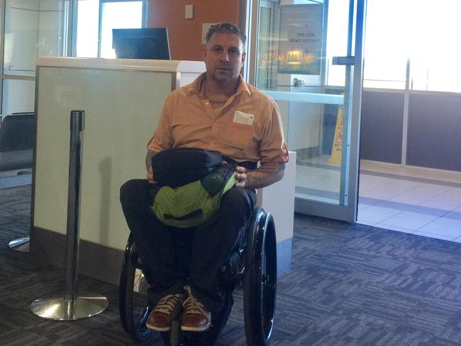 David at the gate of his Scoot flight where he was turned away.