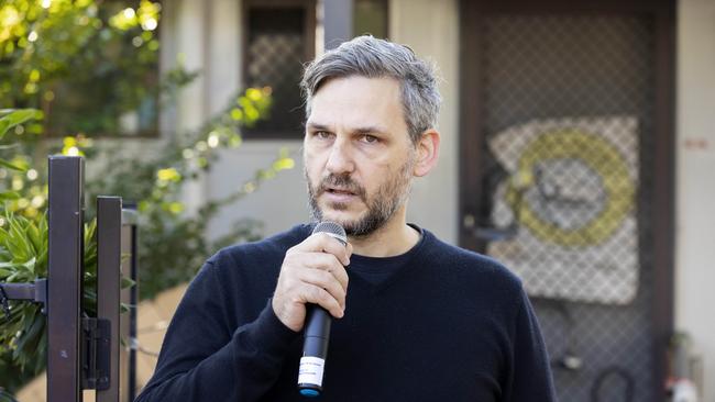 Member for Maiwar Michael Berkman joins protesters gather in Taringa to prevent the eviction of David Barker from public housing, Friday, June 17, 2022. Picture: Richard Walker