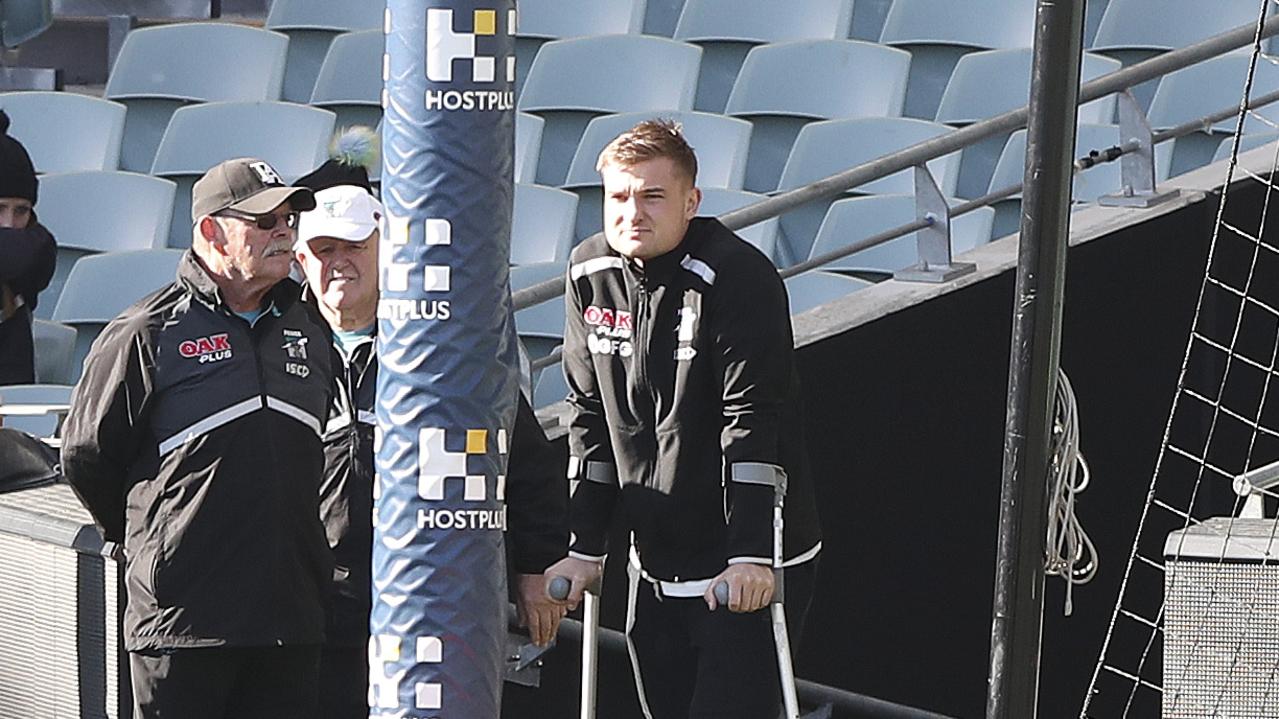 Ollie Wines on crutches during his injury-hampered 2019 season. Picture Sarah Reed