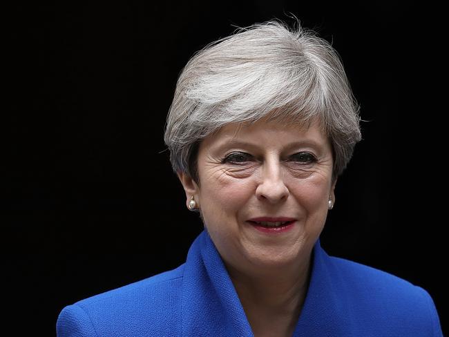 LONDON, ENGLAND - JUNE 09:  Prime Minister Theresa May leaves Downing Street to go to Buckingham Palace where she will seek the Queen's permission to form a UK government on June 9, 2017 in London, England. After a snap election was called by Prime Minister Theresa May the United Kingdom went to the polls yesterday. The closely fought election has failed to return a clear overall majority winner and a hung parliament has been declared.  (Photo by Dan Kitwood/Getty Images)