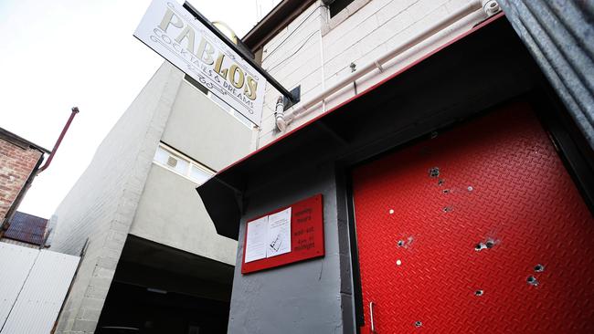 Bullet holes in the door of Pablo's Cocktails and Dreams. Picture: CHRIS KIDD