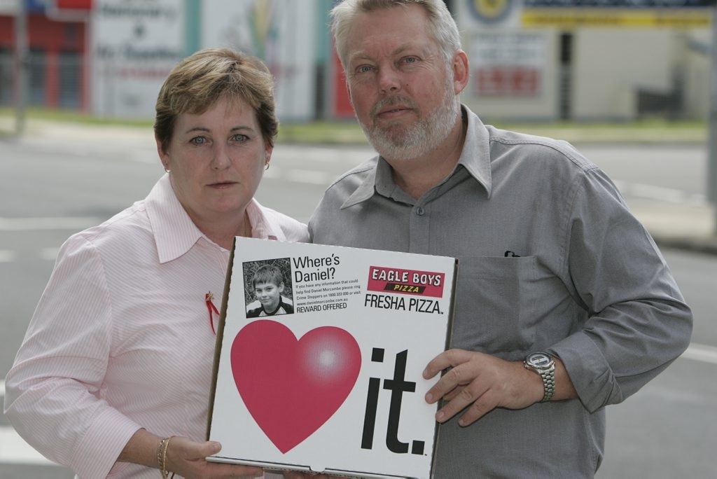 Denise and Bruce Morcombe with the Eagle Boys pizza boxes displaying Daniel's photo in 2004