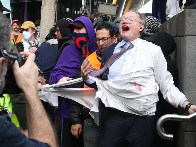 Chaos erupts outside the Melbourne Convention and Exhibition Centre. Picture: David Crosling