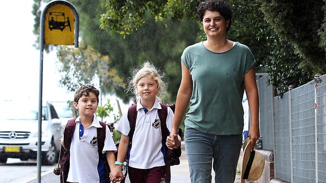 Willoughby Public school mother Louise Relf, picks up her children (L-R) Fletcher (7) and Zoe (9) from school at lunchtime. Picture: Jane Dempster.