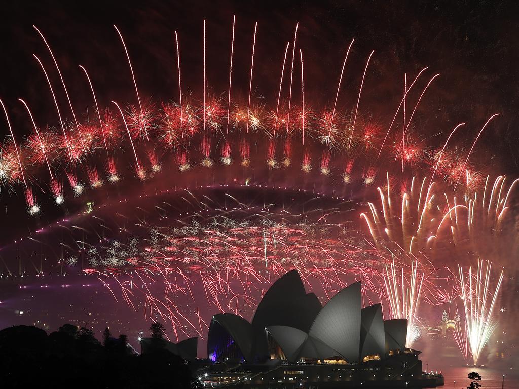 New Year's Eve 2018 - The midnight fireworks display over the Sydney Opera House and Sydney Harbour Bridge from a rooftop in Potts Point. Picture: Toby Zerna