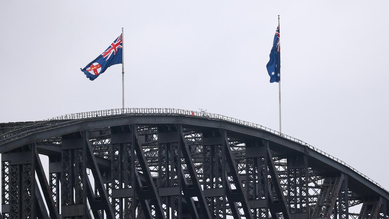 Currently the NSW state flag and Australian flag fly permanently on the Harbour Bridge. Picture: Justin Lloyd