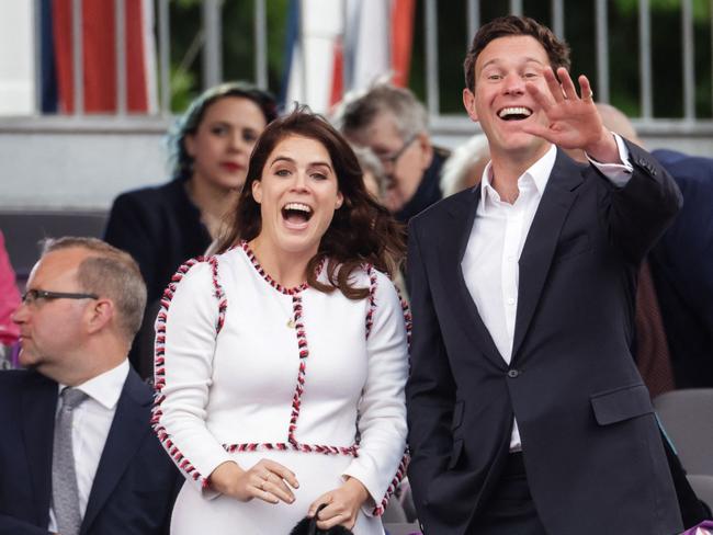 Britain's Princess Eugenie of York and Jack Brooksbank react during the Platinum Party at Buckingham Palace. Picture: AFP