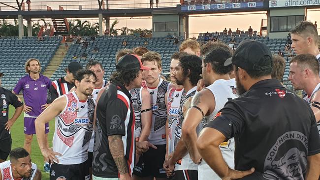 Southern Districts coach Matt Cannard addresses his players at three quarter time.