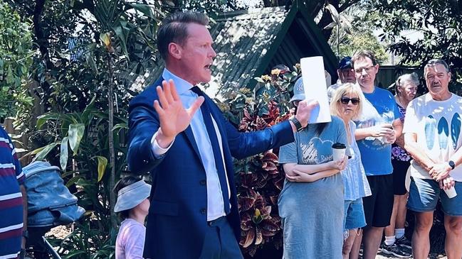 Auctioneer David Holmes presided over the long and hectic bidding war, before the home sold for $1.662 million.