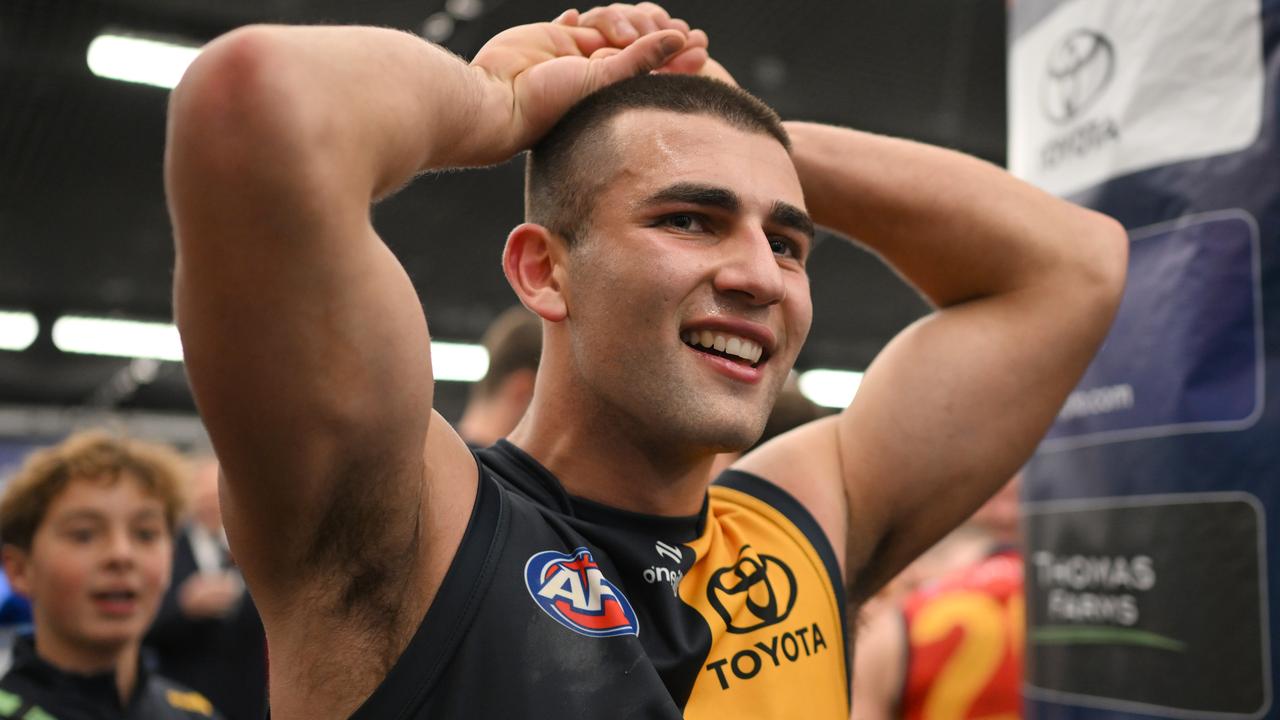 MELBOURNE, AUSTRALIA - JULY 19: Josh Rachele of the Crows celebrates in the rooms after winning the round 19 AFL match between Essendon Bombers and Adelaide Crows at Marvel Stadium, on July 19, 2024, in Melbourne, Australia. (Photo by Daniel Pockett/Getty Images)