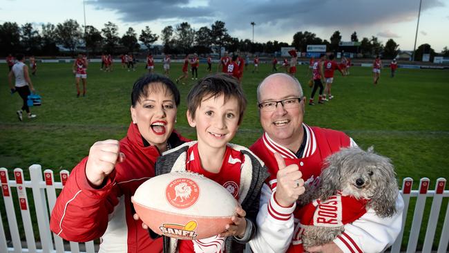 North Adelaide fans Tracey Lee, Adon and Peter Stinear watch the Roosters train on Tuesday. Picture: Naomi Jellicoe