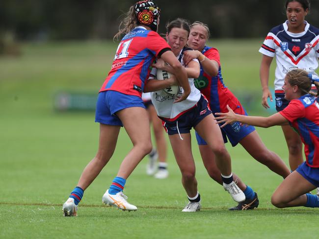 Jayda Durham is tackled by Lily Porter. Picture: Sue Graham