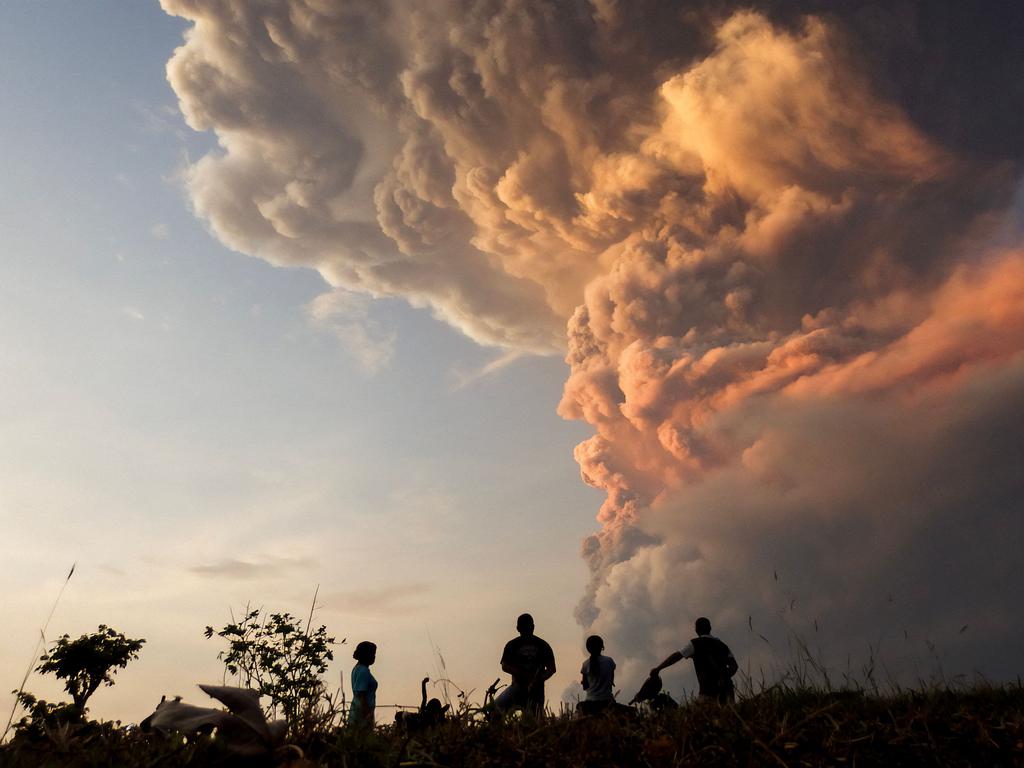 Residents watch the eruption of Mount Lewotobi Laki Laki from Lewolaga village in East Flores, East Nusa Tenggara. Picture: AFP