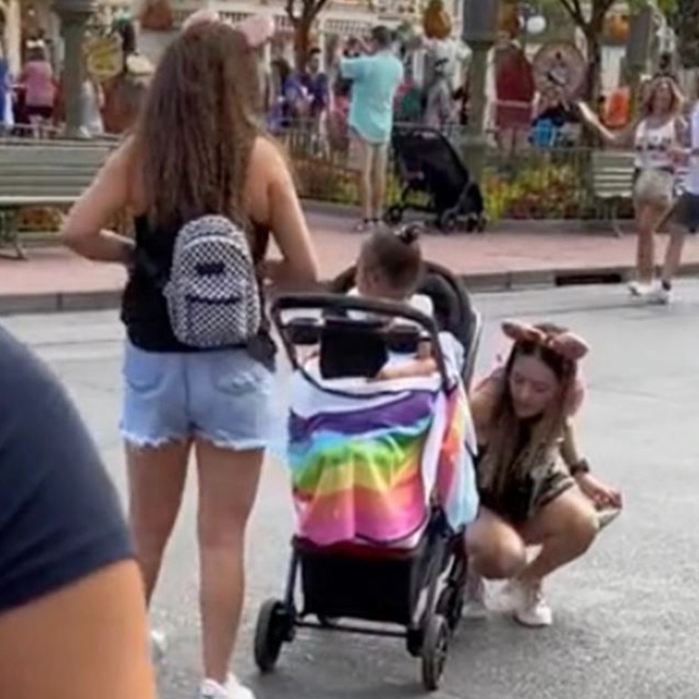 Once past the Disney worker, the woman picked the girl out of the stroller. Picture: TikTok / myfrienditsmebarbie