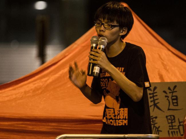 17 year-old student protest leader Joshua Wong speaks to fellow students on the street outside the Hong Kong Government Complex on October 1. Pic Getty.