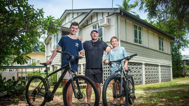 Joel Shiells with his two boys Noah and Henry, aged 14 and 11, at their new home in North Ward, Townsville. Picture: Scott Radford-Chisholm / The Australian