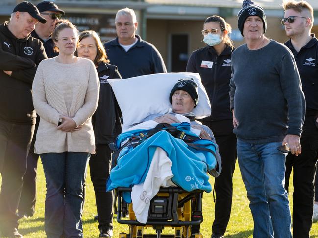 John Guthrie, 63, spent one of his last days taking in the action at his beloved Narre Warren Football Club surrounded by loved ones with the help of the Royal Flying Doctors Service. Picture: Supplied