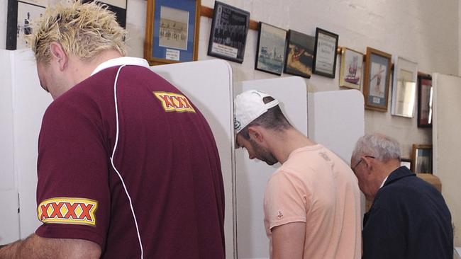 GOLD COAST, AUSTRALIA - AUGUST 21: Voters go to the polls on Federal Election day at Main Beach Pavillion on August 21, 2010 in Gold Coast, Australia. Fourteen million Australians are expected to place their compulsory votes for the country's 43rd Parliament. (Photo by David Hardenberg/Getty Images)