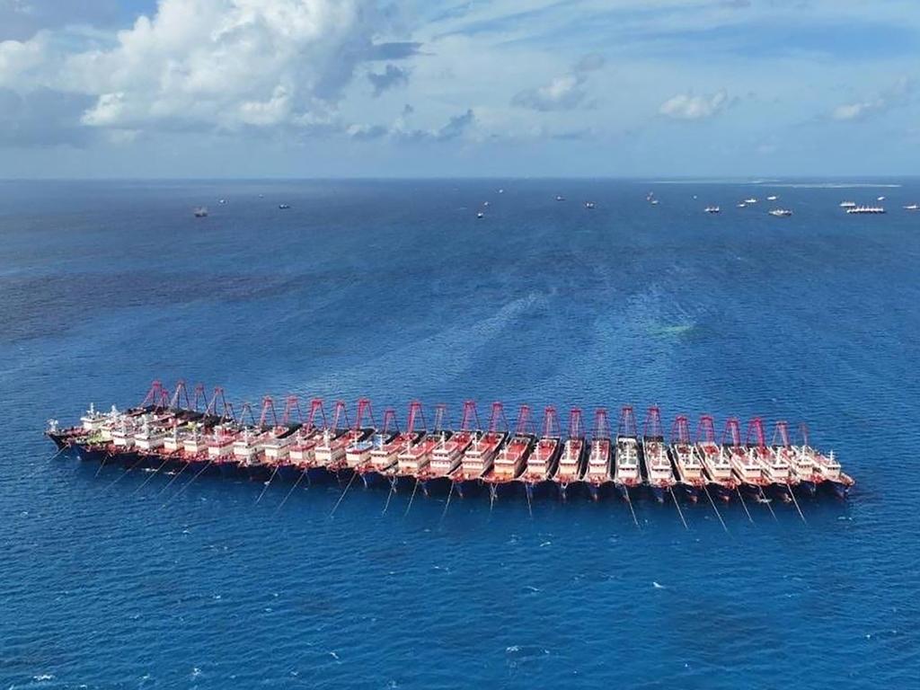 Chinese vessels amass near Whitsun Reef in the disputed South China Sea, raising concerns as the Philippines reports over 135 boats ‘swarming’ the area. Picture: Philippine Coast Guard/AFP