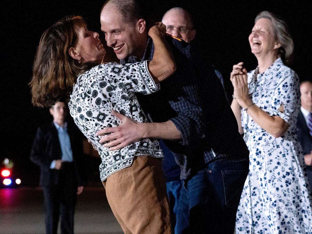 <p>Journalist Evan Gershkovich (center) embraces his mother, Ella Milman, upon his arrival at Joint Base Andrews in Maryland on Thursday, August 1, 2024. Russia released Gershkovich, a Wall Street Journal reporter, along with imprisoned Kremlin critics in the largest prisoner exchange with the West in decades. The exchange secured a sought-after assassin in return, a move closely tied to President Vladimir Putin&rsquo;s priorities. Picture: Ken Cedeno/UPI/Bloomberg via Getty Images.</p>