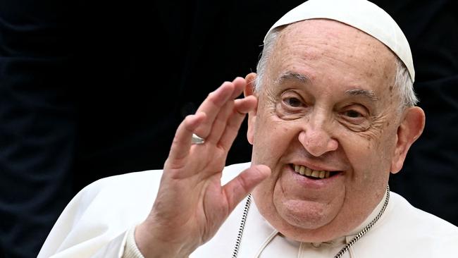 (FILES) Pope Francis waves as he arrives to attend the unveil of a new electric popemobile, at the Vatican on December 4, 2024. Pope Francis passed a 
