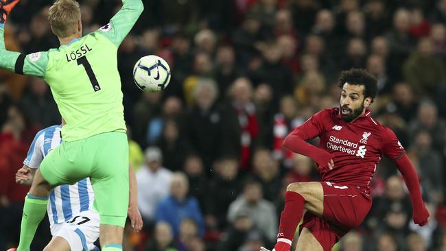 Mohamed Salah lobs the Huddersfield goalkeeper to grab yet another goal.