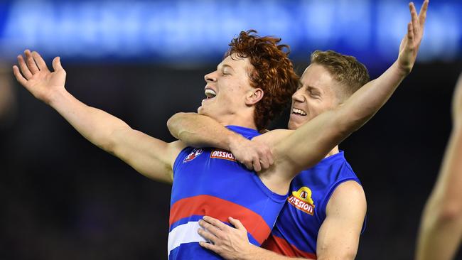 Ed Richards and Lachie Hunter celebrate a goal.