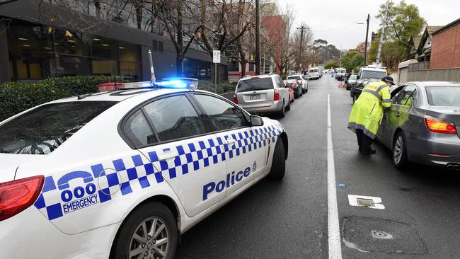 Police at the scene of the Kew apartment block where Elizabeth Wilms was killed. Picture: Steve Tanner