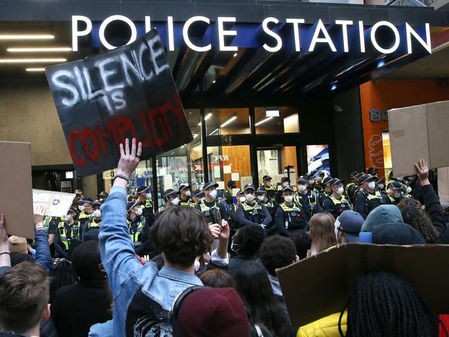 Melbourne demonstrators gather outside the police station on Bourke Street in the city’s CBD. Picture: Wayne Ludbey