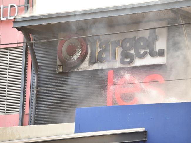 There has been significant damage to shop signage and the roof space. Photo: Adam Hourigan