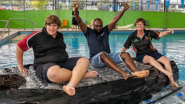 Peter, Ted Chirema and Carol Ayres at Henbury School gets ready for their new boat named Ironic design and construction for the Darwin Lions Beer Can Regatta.Picture: Pema Tamang Pakhrin