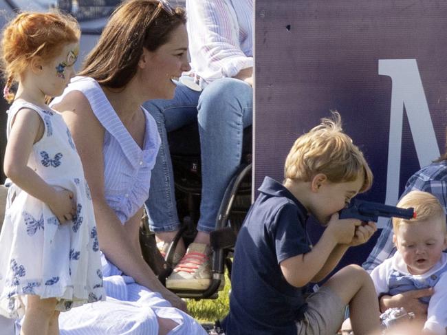 Prince George was spotted playing with a toy gun. Picture: Steve Parsons/PA via AP