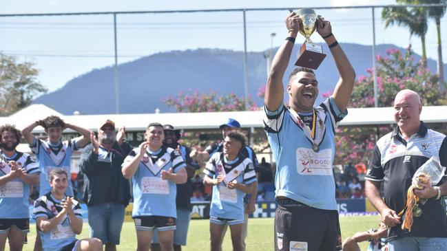 Norths under-19 captain Jondean Asse lifts the premiership trophy.