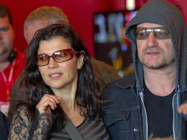 Singer Bono of rock band 'U2' and his wife Ali Hewson backstage at Glastonbury Music Festival in 2011.