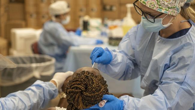 A woma is tested for coronavirus. Picture: Go Nakamura/Getty Images/AFP