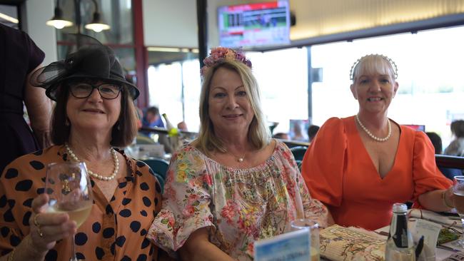 Trish Keliher, Pat Flanegan and Wendy Wongvet ready for a big day at Darwin Turf Club. Picture: (A)manda Parkinson