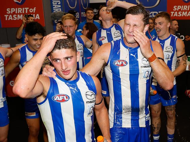 MELBOURNE, AUSTRALIA - MARCH 18: Harry Sheezel (left) and Charlie Comben of the Kangaroos sing the team song during the 2023 AFL Round 01 match between the North Melbourne Kangaroos and the West Coast Eagles at Marvel Stadium on March 18, 2023 in Melbourne, Australia. (Photo by Michael Willson/AFL Photos via Getty Images)